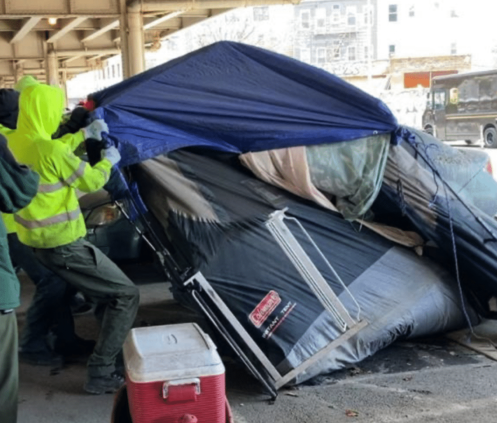 | City workers clear a tent encampment beneath the Brooklyn Queens Expressway in Williamsburg on March 28 | MR Online